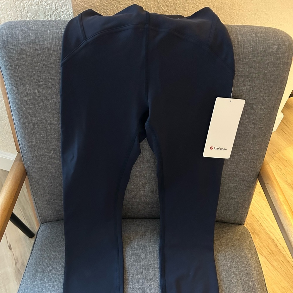 Size 4 lululemon Instill HR Tight 25 in Navy. Purchased Jan 2023, never worn.